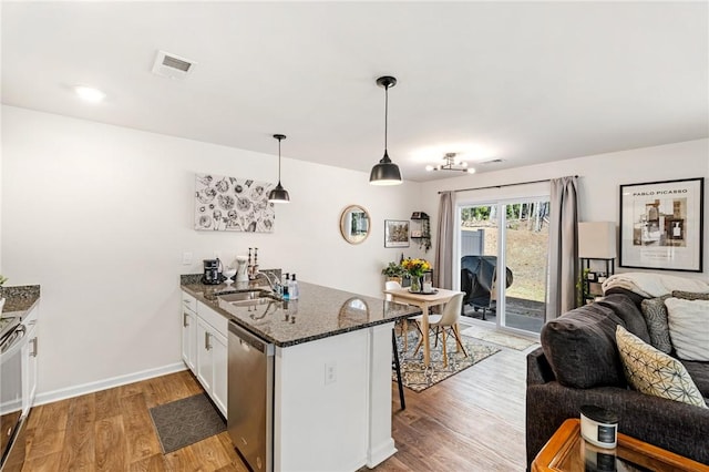 511 Oakmont Valley Trl, Seneca, SC 29678 - kitchen featuring stainless steel dishwasher, a peninsula, visible vents, a sink, and open floor plan