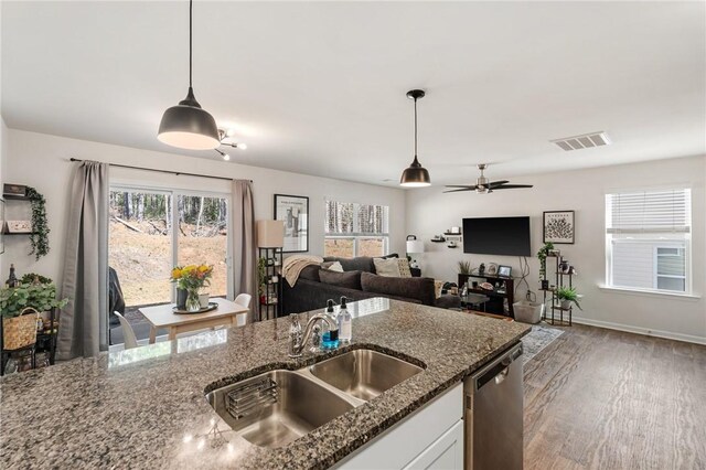 511 Oakmont Valley Trl, Seneca, SC 29678 - kitchen featuring white cabinets, visible vents, dark stone counters, dishwasher, and a sink