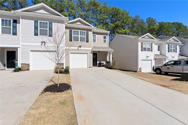 511 Oakmont Valley Trl, Seneca, SC 29678 - townhome / multi-family property with stone siding, a garage, and concrete driveway