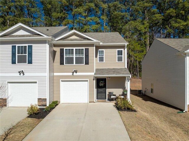511 Oakmont Valley Trl, Seneca, SC 29678 - multi unit property featuring an attached garage, roof with shingles, cooling unit, and concrete driveway