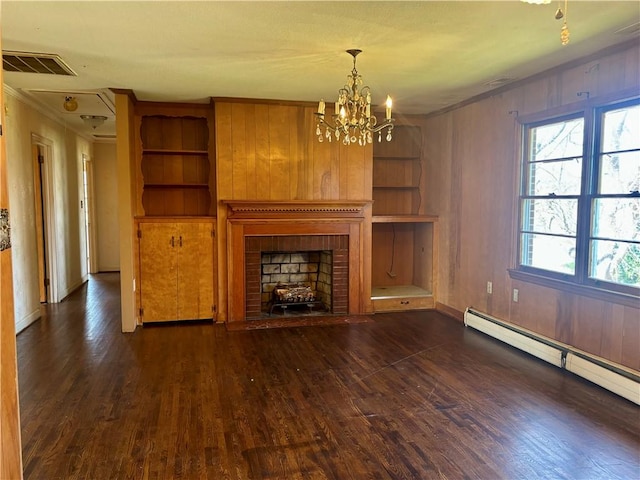 unfurnished living room with an inviting chandelier, wood finished floors, visible vents, and baseboard heating