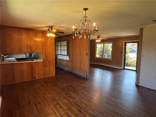 kitchen with a baseboard radiator, brown cabinetry, and ceiling fan with notable chandelier