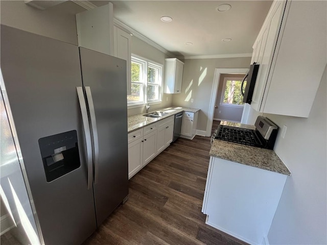 304 Oak Dr, Anderson, SC 29625 - kitchen with white cabinetry, light stone countertops, stainless steel appliances, ornamental molding, and dark wood-type flooring