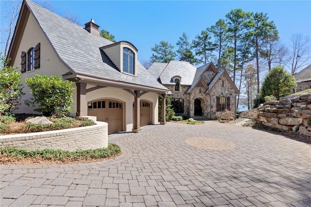 136 Blue Water Trl, Salem, SC 29676 - french country inspired facade featuring a high end roof, a chimney, decorative driveway, a garage, and stone siding