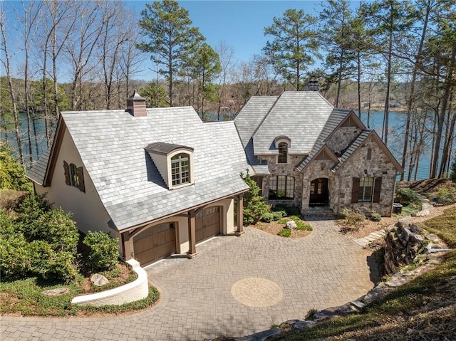 136 Blue Water Trl, Salem, SC 29676 - french provincial home featuring stone siding, stucco siding, driveway, and a chimney