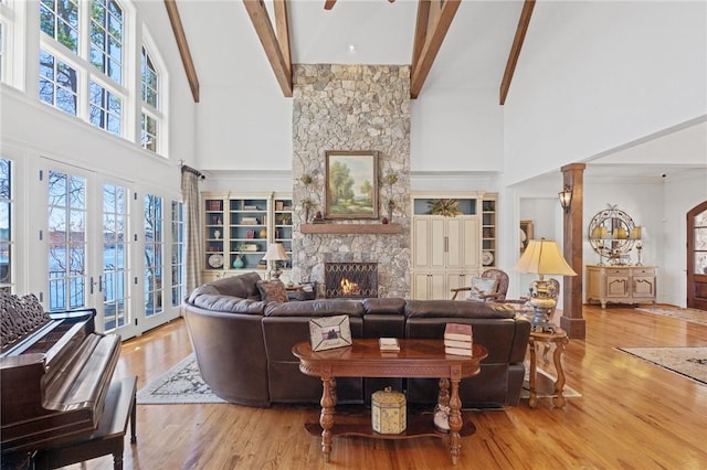 136 Blue Water Trl, Salem, SC 29676 - living area with beam ceiling, a fireplace, a high ceiling, and wood finished floors