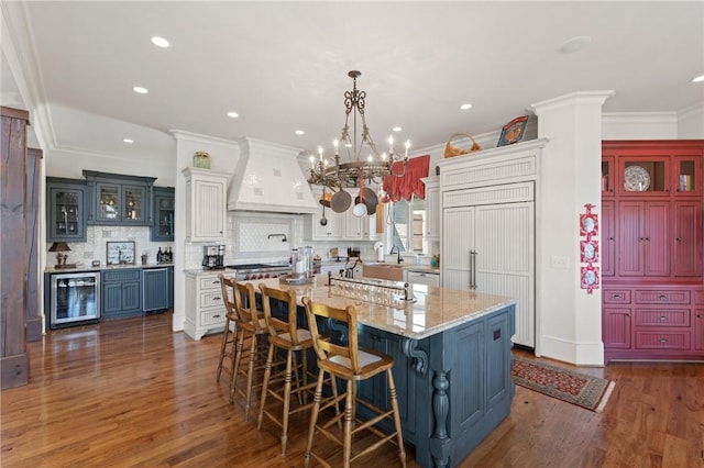 136 Blue Water Trl, Salem, SC 29676 - kitchen featuring paneled refrigerator, dark wood-style floors, beverage cooler, and custom range hood
