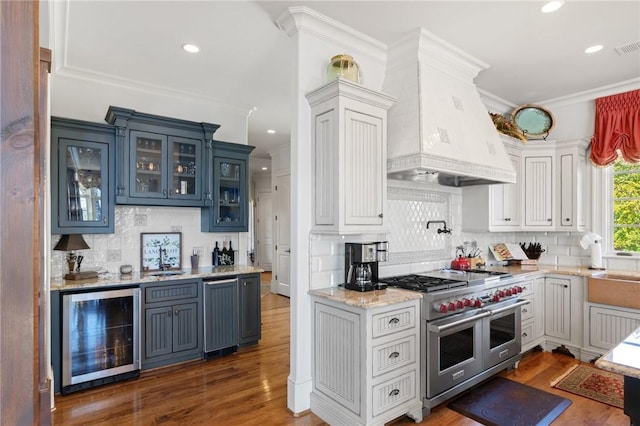 136 Blue Water Trl, Salem, SC 29676 - kitchen with crown molding, beverage cooler, double oven range, wood finished floors, and custom exhaust hood