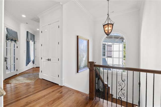 136 Blue Water Trl, Salem, SC 29676 - hall featuring an inviting chandelier, wood finished floors, an upstairs landing, and ornamental molding