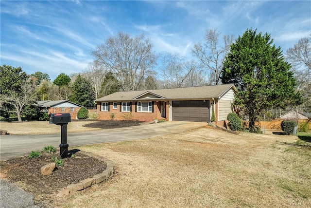 115 Pine Forest Dr, Easley, SC 29642 - ranch-style house with brick siding, concrete driveway, and an attached garage