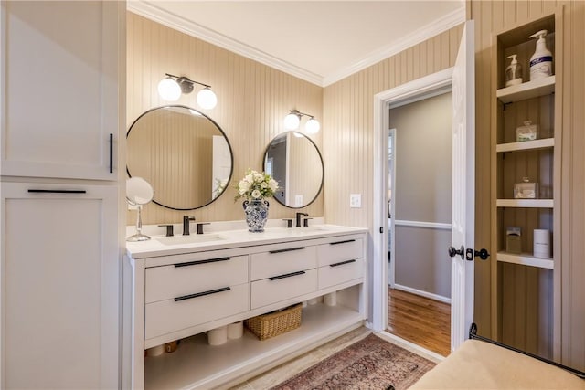 115 Pine Forest Dr, Easley, SC 29642 - bathroom featuring wood finished floors, wallpapered walls, double vanity, a sink, and crown molding