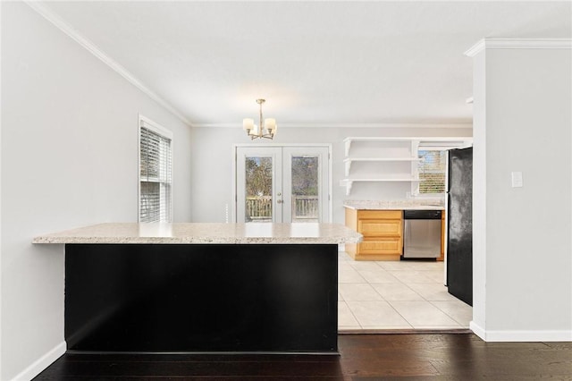 kitchen featuring open shelves, light wood-style flooring, freestanding refrigerator, ornamental molding, and a notable chandelier