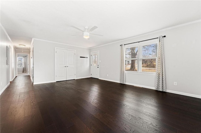 unfurnished living room featuring baseboards, dark wood-type flooring, ornamental molding, and a ceiling fan