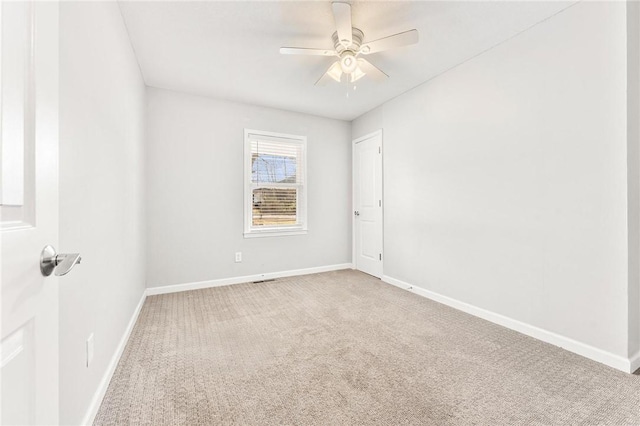 unfurnished room with baseboards, carpet floors, and ceiling fan