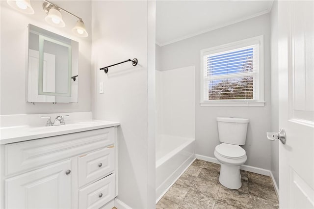 bathroom featuring baseboards, toilet, vanity, and crown molding