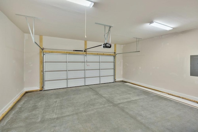 3108 Owens Mills Dr, Anderson, SC 29624 - garage with baseboards, a garage door opener, and electric panel