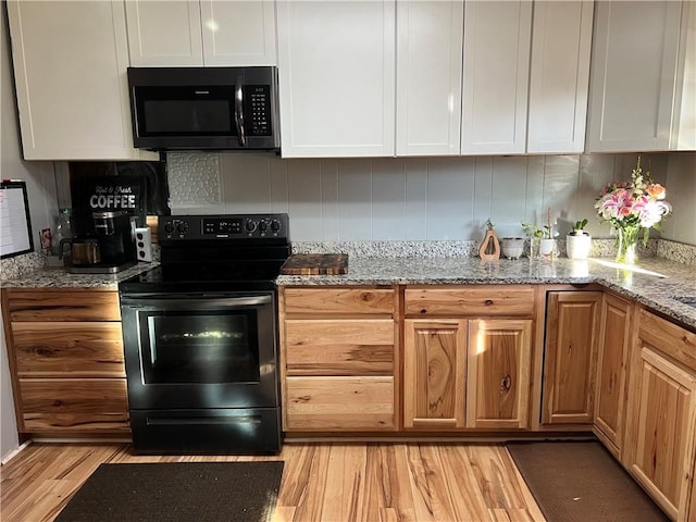 125 Victorian Dr, Anderson, SC 29625 - kitchen with light wood-type flooring, electric range, light stone countertops, and white cabinetry
