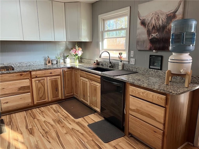125 Victorian Dr, Anderson, SC 29625 - kitchen with stone countertops, light wood-type flooring, white cabinets, a sink, and dishwasher