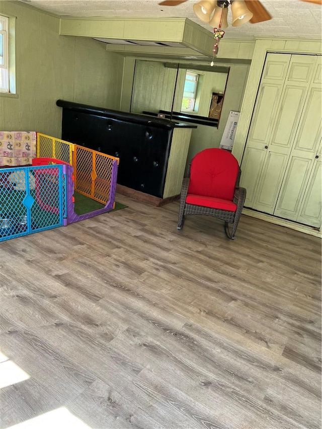 125 Victorian Dr, Anderson, SC 29625 - interior space featuring wooden walls, a textured ceiling, multiple windows, and wood finished floors