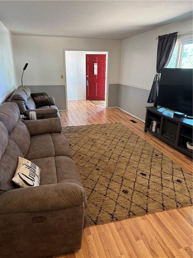 125 Victorian Dr, Anderson, SC 29625 - living area featuring a textured ceiling, visible vents, and wood finished floors