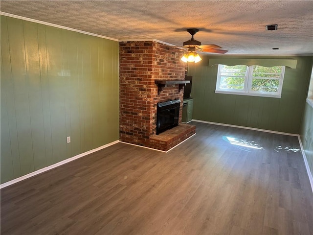 125 Victorian Dr, Anderson, SC 29625 - unfurnished living room featuring ceiling fan, a fireplace, a textured ceiling, baseboards, and wood finished floors