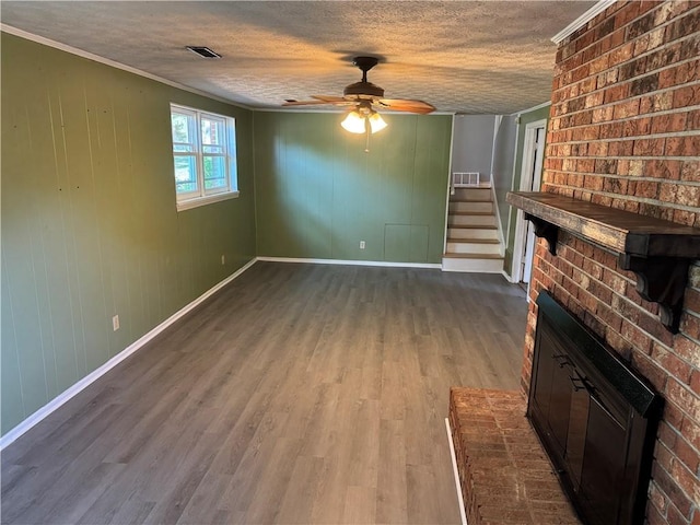 125 Victorian Dr, Anderson, SC 29625 - unfurnished living room with a ceiling fan, dark wood-style flooring, stairway, baseboards, and ornamental molding