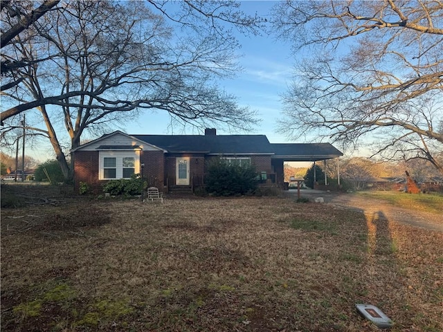1010 Bern Cir, Anderson, SC 29625 - view of front of house with an attached carport, brick siding, and a chimney