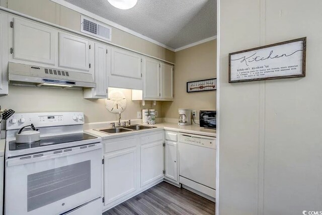 5905 S Kings Hwy Unit 138-A, Myrtle Beach, SC 29575 - kitchen featuring white appliances, under cabinet range hood, a sink, visible vents, and white cabinets