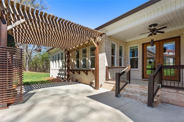 view of patio / terrace with a ceiling fan and a pergola