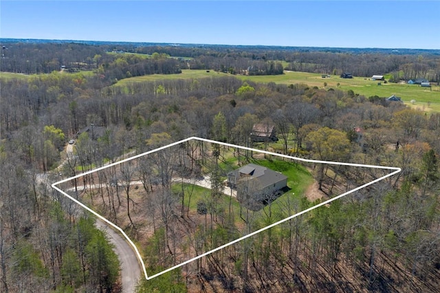 drone / aerial view with a rural view and a view of trees