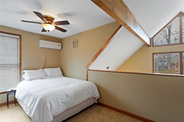 bedroom featuring baseboards, a wall mounted AC, a textured ceiling, and ceiling fan