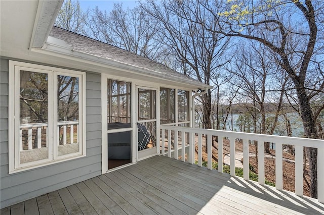 wooden deck featuring a sunroom