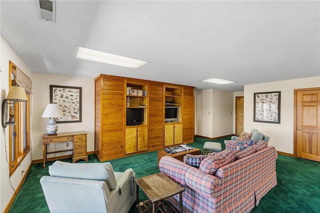 carpeted living area with baseboards, visible vents, and a textured ceiling
