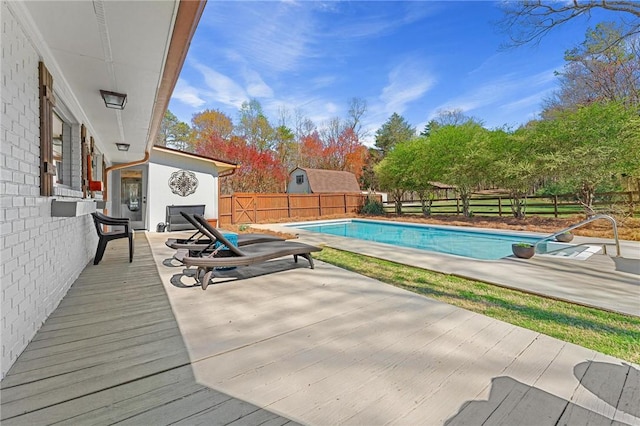 view of swimming pool featuring a fenced in pool, a patio area, and a fenced backyard