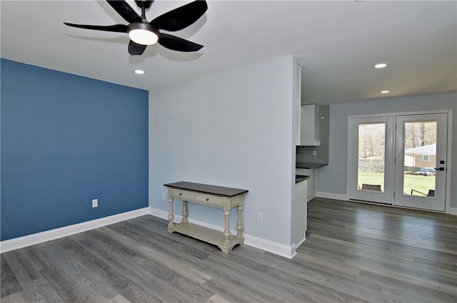unfurnished room featuring a ceiling fan, recessed lighting, baseboards, and wood finished floors