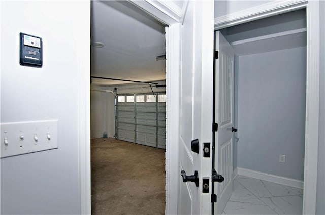 garage featuring baseboards