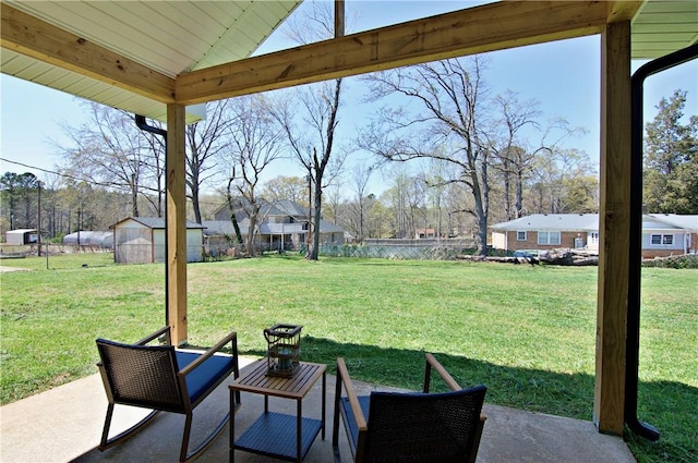 view of yard featuring a fenced backyard, a storage shed, an outbuilding, and a patio