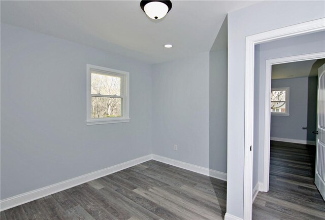 unfurnished room with recessed lighting, baseboards, and dark wood finished floors