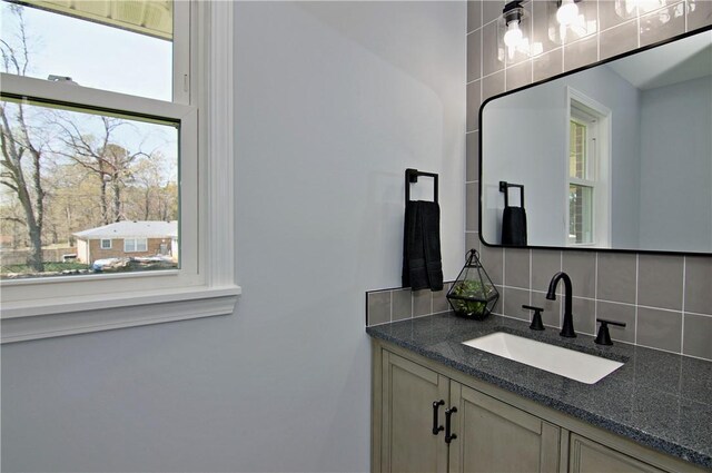 bathroom with backsplash and vanity