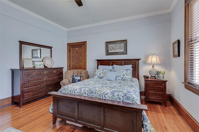 bedroom with baseboards, ceiling fan, crown molding, and light wood-type flooring
