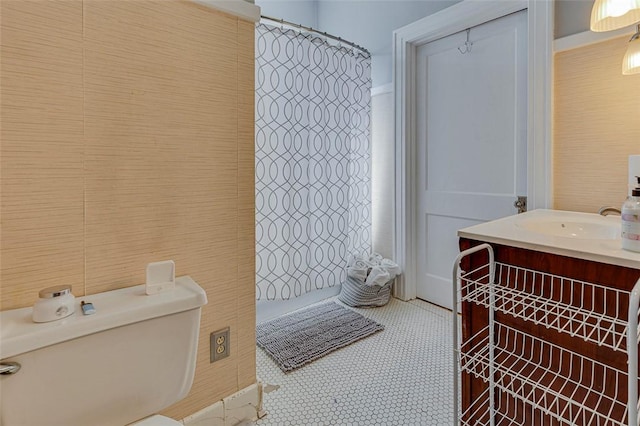 bathroom featuring tile patterned floors, toilet, and vanity