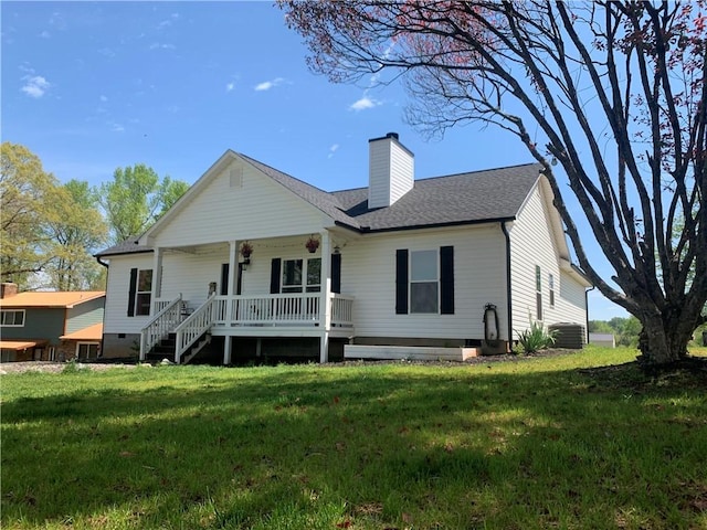 view of front of house with a porch, a chimney, a front lawn, roof with shingles, and crawl space