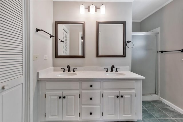full bathroom with tile patterned flooring, a sink, double vanity, and a shower stall