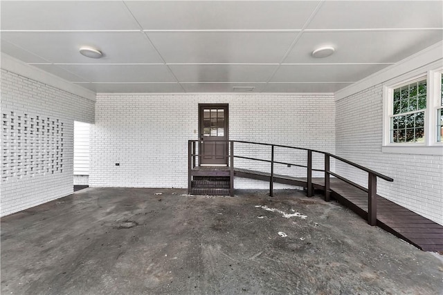 property entrance featuring brick siding