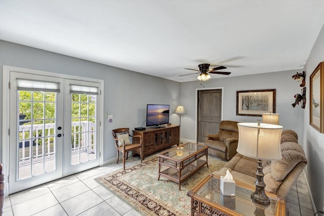 living room featuring baseboards, ceiling fan, french doors, and light tile patterned floors