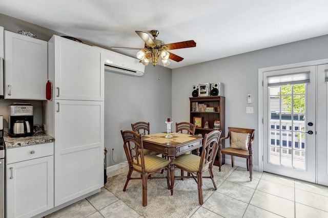 dining room featuring a wall mounted air conditioner, ceiling fan, baseboards, and light tile patterned floors