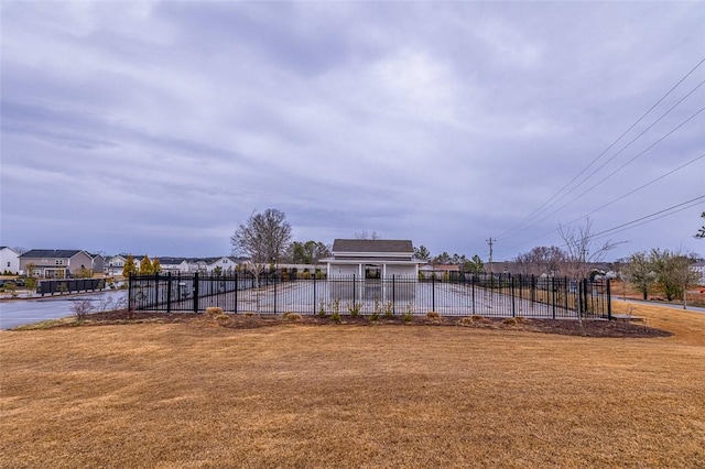 view of yard with a residential view and fence