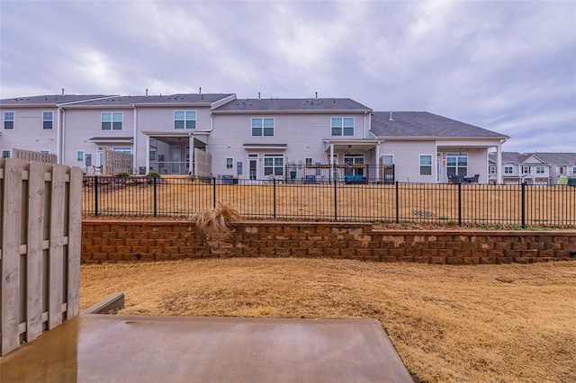 view of yard featuring a fenced backyard and a residential view