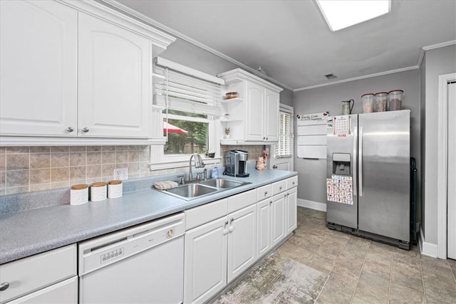 kitchen with stainless steel fridge with ice dispenser, ornamental molding, a sink, white dishwasher, and baseboards