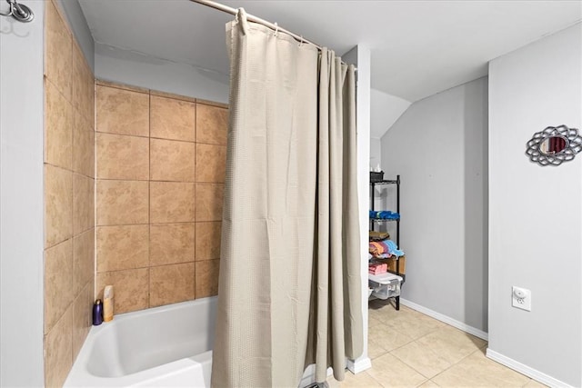 bathroom with baseboards, tile patterned flooring, and shower / tub combo with curtain